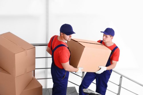 Packed office boxes and furniture ready for transport