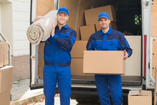 Professional movers carrying furniture during an Enfieldtown relocation