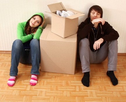 Packed boxes and furniture ready for transport by moving van