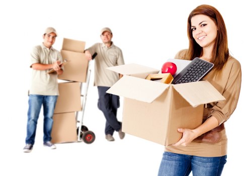 Removal van and mover helping with furniture transport in Enfieldtown