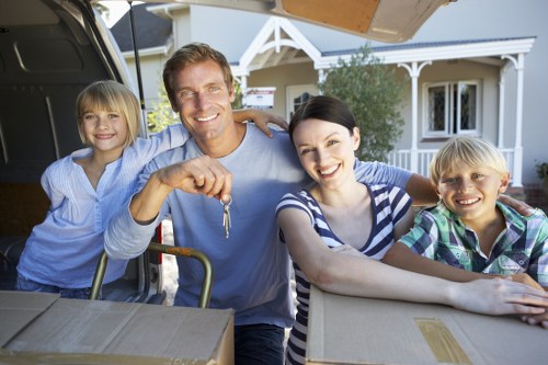 Moving team handling household furniture for an Enfieldtown relocation