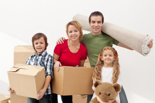Packed office furniture and equipment ready for a local business move