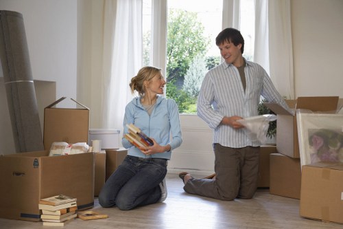 Removal team carrying furniture through a residential street