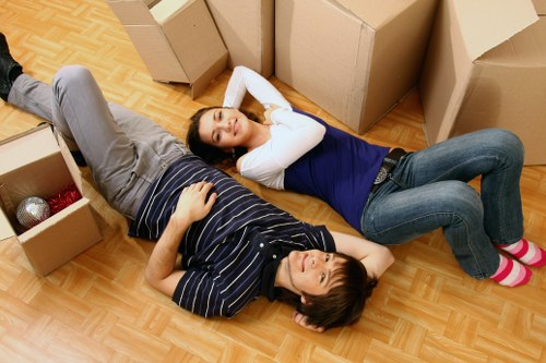 Local moving team loading boxes and furniture into a van