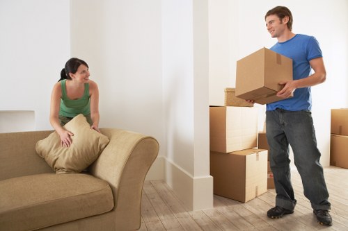 Careful packing and wrapping of household items for a home move